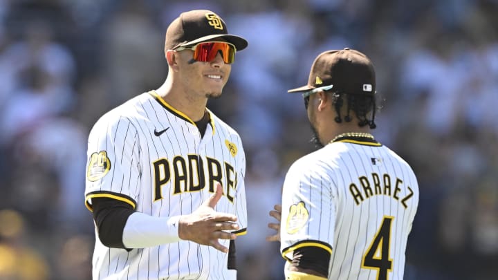 August 14, 2024; San Diego, California, USA; San Diego Padres third base Manny Machado (13) and Luis Arraez (4) react after the game at Petco Park. Mandatory Credit: Denis Poroy-USA TODAY Sports at Petco Park.