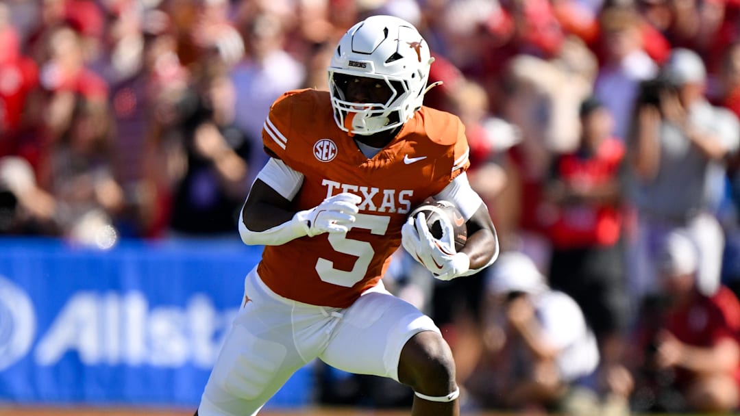 Texas Longhorns running back Quintrevion Wisner (5) runs with the ball against the Oklahoma Sooners during the first half at the Cotton Bowl. Mandatory Credit: