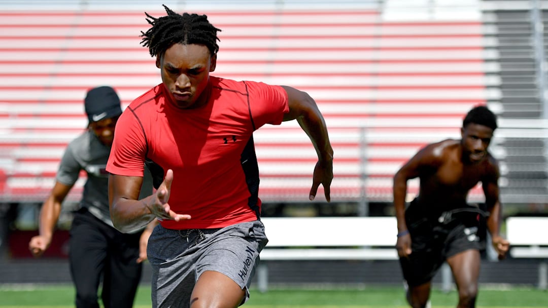Laron Dues runs sprints with teammates Monday Monday morning. Cardinal Mooney High football players participate in the school's summer strength and conditioning camp Monday, July 22, 2024. The Cougars won the FHSAA Class 1S state championship last year, defeating Trinity Catholic.
