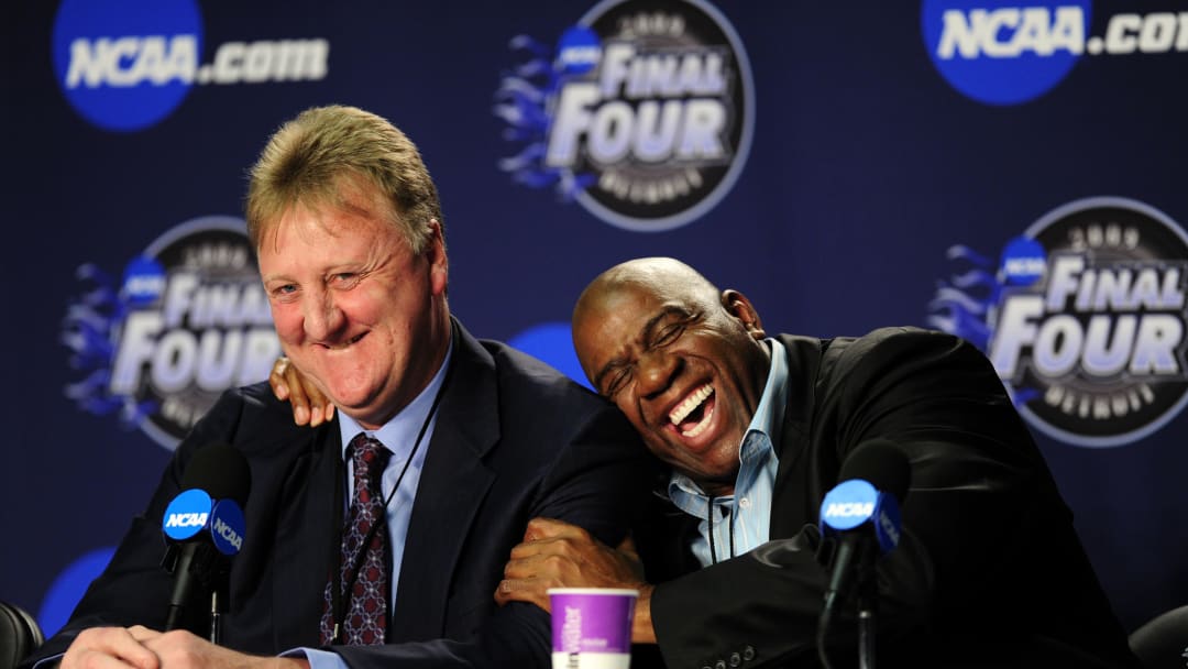 Apr 6, 2009; Detroit, MI, USA; Michigan State Spartans and NBA former player Magic Johnson (right) hugs NBA former player Larry Bird (left) during a press conference before the championship game of the Final Four in the 2009 NCAA mens basketball tournament against the North Carolina Tar Heels at Ford Field. Mandatory Credit: Bob Donnan-USA TODAY Sports
