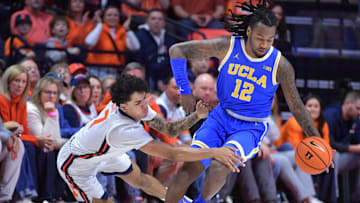 UCLA guard Sebastian Mack (12) brings the ball up court during the first half against Illinois on Tuesday. 