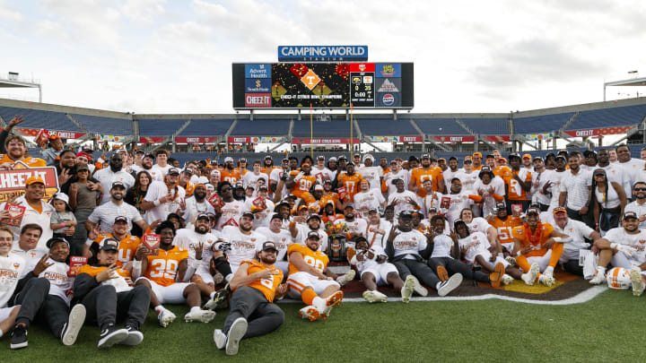 Jan 1, 2024; Orlando, FL, USA; Tennessee Volunteers players pose for a photo to celebrate the win over the Iowa Hawkeyes at Camping World Stadium. Mandatory Credit: Morgan Tencza-USA TODAY Sports