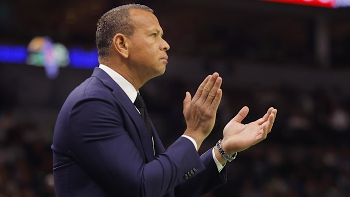 Alex Rodriguez cheers as the Minnesota Timberwolves play the Houston Rockets.