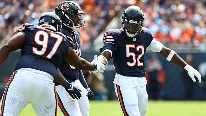 Darrell Taylor gets congratulations from Andrew Billings after one of his sacks in Sunday's Bears win.