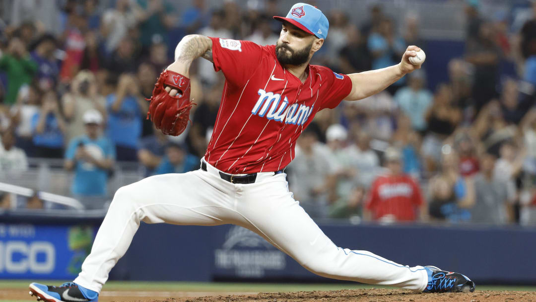 Jul 6, 2024; Miami, Florida, USA; Miami Marlins relief pitcher Tanner Scott (66) pitches against the Chicago White Sox during the ninth inning at loanDepot Park.