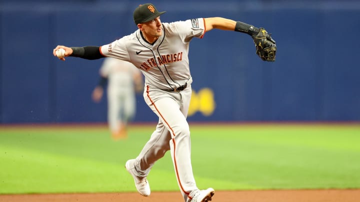 Apr 13, 2024; St. Petersburg, Florida, USA;  San Francisco Giants shortstop Nick Ahmed (16) throws to first for an out against the Tampa Bay Rays in the second inning at Tropicana Field