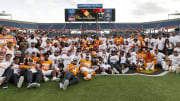 Jan 1, 2024; Orlando, FL, USA; Tennessee Volunteers players pose for a photo to celebrate the win over the Iowa Hawkeyes at Camping World Stadium. Mandatory Credit: Morgan Tencza-USA TODAY Sports