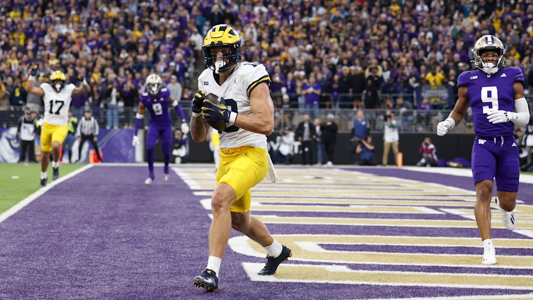 Oct 5, 2024; Seattle, Washington, USA; Michigan Wolverines tight end Colston Loveland (18) catches a touchdown pass against the Washington Huskies during the third quarter at Alaska Airlines Field at Husky Stadium. Oct 5, 2024; Seattle, Washington, USA; Michigan Wolverines tight end Colston Loveland (18) catches a touchdown pass against the Washington Huskies during the third quarter at Alaska Airlines Field at Husky Stadium.