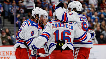 Nov 20, 2025; Denver, Colorado, USA; New York Rangers center J.T. Miller (8) celebrates his goal with center Vincent Trocheck (16) and center Mika Zibanejad (93) in the first period against the Colorado Avalanche at Ball Arena. Mandatory Credit: Isaiah J. Downing-Imagn Images