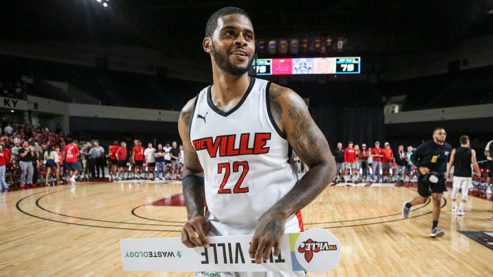 TheVille's Chane Behanan smiles while carrying the team's placard after the team defeated Jackson TN at the TBT second round of the Louisville Regional at Freedom Hall July 27, 2023.