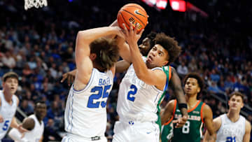 Elijah Crawford and Dawson Baker crash for the rebound.