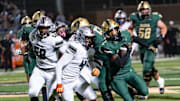 Basha Bears run with the ball against the Hamilton Huskies during a game at Basha High School in Chandler on Oct. 24, 2025.