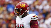 Sep 7, 2025; Landover, Maryland, USA; Washington Commanders defensive tackle Javon Kinlaw (99) celebrates after a play during the first quarter against the New York Giants at Northwest Stadium. Mandatory Credit: Peter Casey-Imagn Images