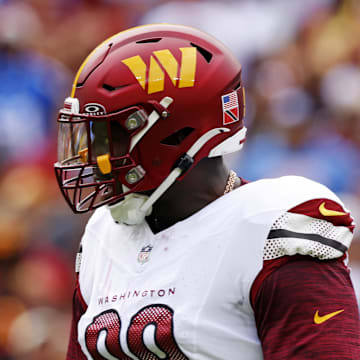 Sep 7, 2025; Landover, Maryland, USA; Washington Commanders defensive tackle Javon Kinlaw (99) celebrates after a play during the first quarter against the New York Giants at Northwest Stadium. Mandatory Credit: Peter Casey-Imagn Images