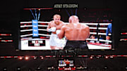 Nov 15, 2024; Arlington, Texas, UNITED STATES;  Mike Tyson (black gloves) fights Jake Paul (silver gloves) at AT&T Stadium. 