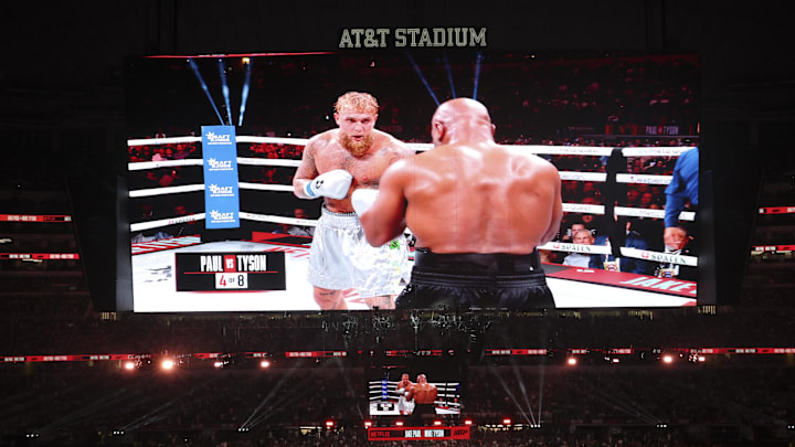 Nov 15, 2024; Arlington, Texas, UNITED STATES; Mike Tyson (black gloves) fights Jake Paul (silver gloves) at AT&T Stadium. Nov 15, 2024; Arlington, Texas, UNITED STATES; Mike Tyson (black gloves) fights Jake Paul (silver gloves) at AT&T Stadium.