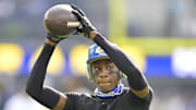 Jan 5, 2025; Inglewood, California, USA; Los Angeles Rams cornerback Emmanuel Forbes Jr. (25) warms up prior to the game against the Seattle Seahawks at SoFi Stadium. Mandatory Credit: Jayne Kamin-Oncea-Imagn Images
