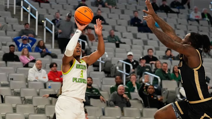 Mar 16, 2024; Fort Worth, TX, USA;  South Florida Bulls guard Chris Youngblood (3) attempts a three point basket against UAB Blazers guard Alejandro Vasquez (10) during the first half at Dickies Arena. Mandatory Credit: Chris Jones-Imagn Images