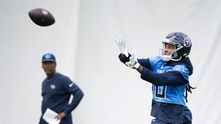 Wide receiver DeAndre Hopkins (10) watches a pass into his hands during the Tennessee Titans mandatory mini-camp at Ascension Saint Thomas Sports Park in Nashville, Tenn., Tuesday, June 4, 2024.