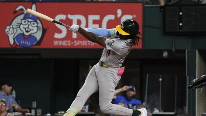 Oakland Athletics right fielder Lawrence Butler (4) follows through as he hits a solo home run during the fourth inning against the Texas Rangers at Globe Life Field on Aug 31.