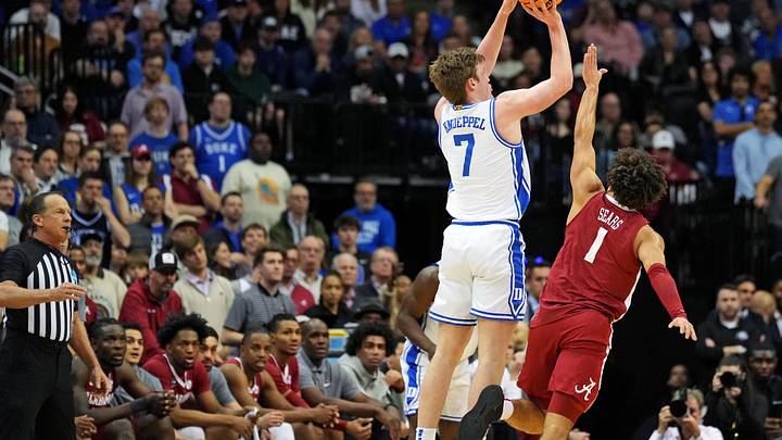 Mar 29, 2025; Newark, NJ, USA; Duke Blue Devils guard Kon Knueppel (7) shoots the ball against Alabama Crimson Tide guard Mark Sears (1) during the first half.