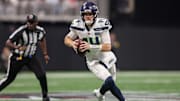 Dec 7, 2025; Atlanta, Georgia, USA; Seattle Seahawks quarterback Sam Darnold (14) runs the ball against the Atlanta Falcons in the fourth quarter at Mercedes-Benz Stadium. Mandatory Credit: Brett Davis-Imagn Images