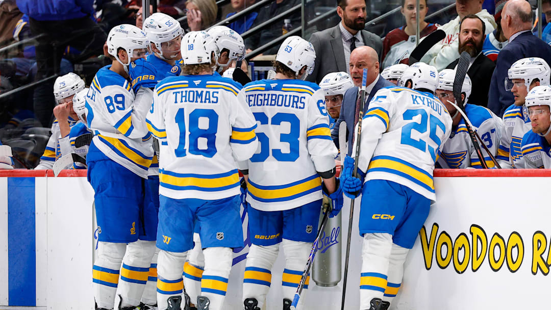 Apr 5, 2026; Denver, Colorado, USA; St. Louis Blues head coach Jim Montgomery talks with defenseman Colton Parayko (55) and left wing Pavel Buchnevich (89) and center Robert Thomas (18) and left wing Jake Neighbours (63) and right wing Jordan Kyrou (25) in the third period against the Colorado Avalanche at Ball Arena. Mandatory Credit: Isaiah J. Downing-Imagn Images