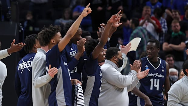 Mar 17, 2022; Indianapolis, IN, USA; Saint Peter's Peacocks react after upsetting Kentucky Wildcats in 2022 NCAA Tournament.