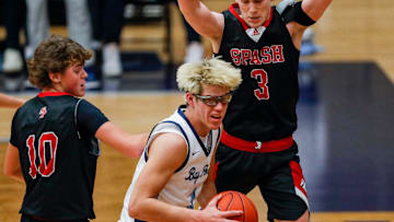 SPASH’s Sam Kornowski (10) and Trent Chandonais (3) defend Bay Port High School's Matt Stevens (3) on Tuesday, December 2, 2025, at Bay Port High School in Suamico, Wis. Bay Port won the game, 62-59, on a buzzer-beater by AJ Ivy.
Tork Mason/USA TODAY NETWORK-Wisconsin