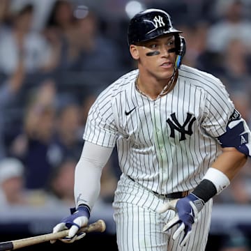 Jul 8, 2025; Bronx, New York, USA; New York Yankees right fielder Aaron Judge (99) watches his solo home run against the Seattle Mariners during the seventh inning at Yankee Stadium. Mandatory Credit: Brad Penner-Imagn Images