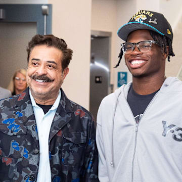 The Jacksonville Jaguars first-round pick, Colorado Buffaloes wide receiver and defensive back Travis Hunter, right, was greeted by Jaguars owner Shahid Khan.