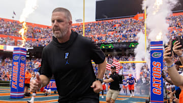 Florida Gators head coach Billy Napier runs onto the field before the start of the game at Ben Hill Griffin Stadium in Gainesville, FL on Saturday, September 7, 2024 against the Samford Bulldogs. The Gators won 45-7. [Doug Engle/Gainesville Sun]