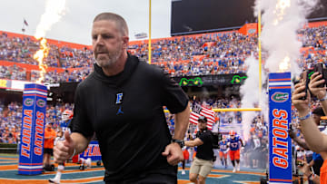 Florida Gators head coach Billy Napier runs onto the field before the start of the game at Ben Hill Griffin Stadium in Gainesville, FL on Saturday, September 7, 2024 against the Samford Bulldogs. The Gators won 45-7. [Doug Engle/Gainesville Sun]