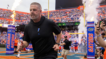 Florida Gators head coach Billy Napier runs onto the field before the start of the game at Ben Hill Griffin Stadium in Gainesville, FL on Saturday, September 7, 2024 against the Samford Bulldogs. The Gators won 45-7. [Doug Engle/Gainesville Sun]