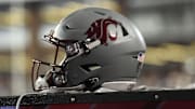 Sep 4, 2021; Pullman, Washington, USA; Washington State Cougars helmet sits during a game against the Utah State Aggies in the first half at Gesa Field at Martin Stadium. Mandatory Credit: James Snook-Imagn Images