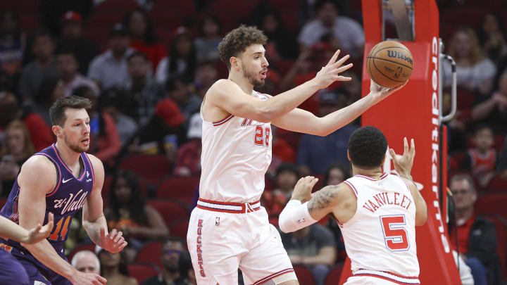 Feb 23, 2024; Houston, Texas, USA; Houston Rockets center Alperen Sengun (28) grabs a rebound during the first quarter against the Phoenix Suns at Toyota Center. Mandatory Credit: Troy Taormina-USA TODAY Sports