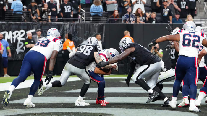 Oct 15, 2023; Paradise, Nevada, USA; New England Patriots quarterback Mac Jones (10) is sacked for a