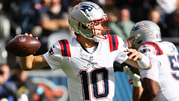 Nov 10, 2024; Chicago, Illinois, USA; New England Patriots quarterback Drake Maye (10) drops back to pass against the Chicago Bears during the first quarter at Soldier Field. Mandatory Credit: Mike Dinovo-Imagn Images