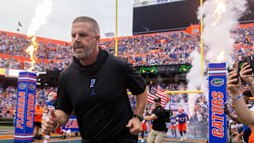 Florida Gators head coach Billy Napier runs onto the field before the start of the game at Ben Hill Griffin Stadium in Gainesville, FL on Saturday, September 7, 2024 against the Samford Bulldogs. The Gators won 45-7. [Doug Engle/Gainesville Sun]