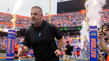 Florida Gators head coach Billy Napier runs onto the field before the start of the game at Ben Hill Griffin Stadium in Gainesville, FL on Saturday, September 7, 2024 against the Samford Bulldogs. The Gators won 45-7. [Doug Engle/Gainesville Sun]