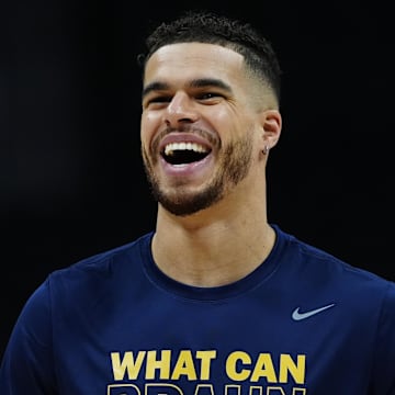Apr 11, 2025; Denver, Colorado, USA; Denver Nuggets forward Michael Porter Jr. (1) reacts before the game against the Memphis Grizzlies at Ball Arena. Mandatory Credit: Ron Chenoy-Imagn Images