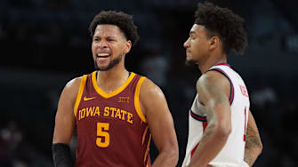 Nov 24, 2025; Las Vegas, Nevada, USA; Iowa State Cyclones forward Joshua Jefferson (5) celebrates as St. John's Red Storm forward Dillon Mitchell (1) watches in the second half in a 2025 Players Era Festival group play game at Michelob Ultra Arena. 