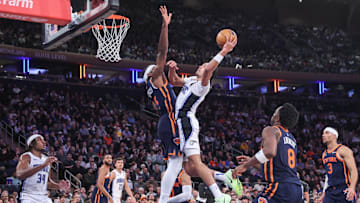 Jan 6, 2025; New York, New York, USA;  Orlando Magic guard Anthony Black (0) looks to drive past New York Knicks forward Precious Achiuwa (5) in the fourth quarter at Madison Square Garden. Mandatory Credit: Wendell Cruz-Imagn Images