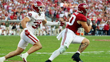 Nov 15, 2025; Tuscaloosa, Alabama, USA;  Alabama Crimson Tide tight end Josh Cuevas (80) runs with the ball against Oklahoma Sooners linebacker Owen Heinecke (38) during the first half at Saban Field at Bryant-Denny Stadium. 