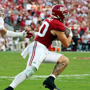 Nov 15, 2025; Tuscaloosa, Alabama, USA;  Alabama Crimson Tide tight end Josh Cuevas (80) runs with the ball against Oklahoma Sooners linebacker Owen Heinecke (38) during the first half at Saban Field at Bryant-Denny Stadium. 
