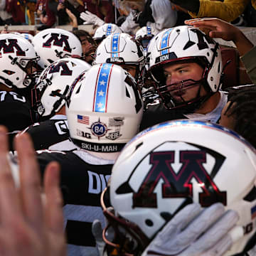 Nov 1, 2025; Minneapolis, Minnesota, USA; Minnesota Golden Gophers players celebrate Minnesota Golden Gophers quarterback Drake Lindsey’s game winning touchdown during overtime against the Michigan State Spartans at Huntington Bank Stadium. Mandatory Credit: Matt Krohn-Imagn Images