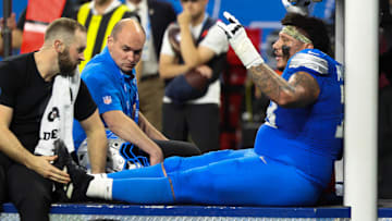 Nov 2, 2025; Detroit, Michigan, USA; Detroit Lions offensive lineman Christian Mahogany (73) is helped off the field after an injury in the fourth quarter against the Minnesota Vikings at Ford Field. Mandatory Credit: David Reginek-Imagn Images