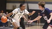 Army's Jalen Rucker drives around Fairleigh Dickinson University's Dylan Jones during the game on November 20, 2024.