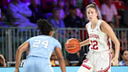 Indiana Hoosiers guard Yarden Garzon (12) dribbles as North Carolina Tar Heels guard Indya Nivar (24) defends during the first half at the Atlantis Resort
