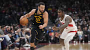 Jan 13, 2025; Toronto, Ontario, CAN; Golden State Warriors guard Stephen Curry (30) dribbles past Toronto Raptors guard Davion Mitchell (45) during the second half at Scotiabank Arena. Mandatory Credit: John E. Sokolowski-Imagn Images